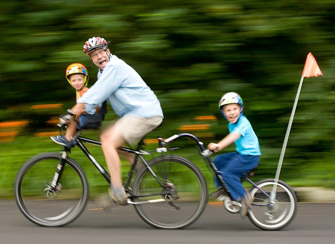 nick kelsh on bike with boys high speed