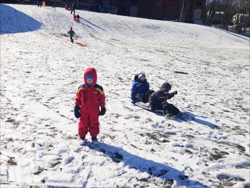If you want to see detail in your little sledders you need to expose for the kids and not the snow covered hill. If you take a light reading off of a snowy hill, you need to brighten your exposure to make up for it.