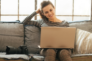 Woman with Laptop and Camera